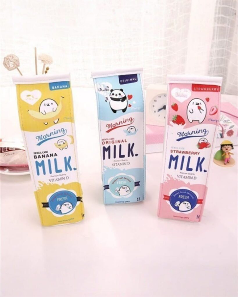 Set of milk box pencil cases featuring banana, strawberry, and original designs. Cute stationery storage.