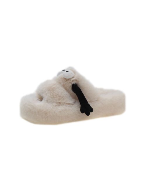 Cream-colored fluffy hand holding slippers, featuring a black bow detail.