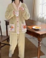 Thick plush pajamas set featuring a cozy, textured fabric and floral accents.