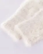 Close-up of a fluffy, white neko sweater with a soft texture.