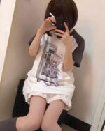 Harajuku detachable sleeve shirt featuring a graphic tee with a girl character and lace shorts.