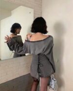 Gray grunge aesthetic dress featuring an off-shoulder design and corset lacing details.