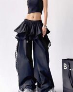 Black y2k cargo pants with a ruffled skirt and lace detailing.