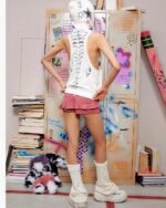 White sleeveless punk hoodie with a graphic design, grunge aesthetic, worn by a model.