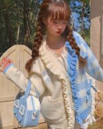 Light blue and cream Milkshake Knitted Cardigan - Harajuku aesthetic cardigan, styled with braids and a bag.