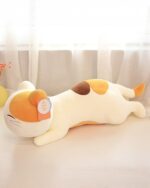 Kawaii ApriCat plushie lying down, featuring cream, brown, and orange colors.