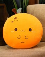 Kawaii fruit plushie cushion, an orange peach-shaped plush toy with facial details.