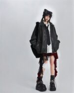 Black checkered punk lolita skirt with layered details and paired with a jacket and boots.