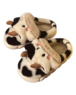 Pair of plush cow slippers featuring a cow-print design and felt ears.