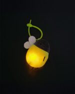 Glowing firefly plush keychain, soft and light-up charm.