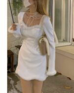 White kawaii winter dress with puff sleeves and tie details.