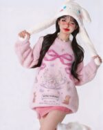 Pink kawaii rabbit sweater with rabbit and teacup details, vintage style.