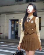 Korean school uniform style three-piece suit, college aesthetic brown pleated skirt and vest outfit.