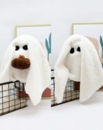 Cute Halloween Decor - Ghost Plush toy, a white plush ghost with brown eyes and mouth, sitting in a basket.