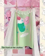 Kawaii lime shirt on hanger, featuring a strawberry design and Harajuku aesthetic.