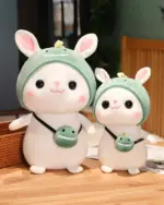 Two kawaii bunny plushies, Cotton the Adventurous Rabbit and a smaller version, both wearing hats and holding snacks. Aesthetic rabbit toy.