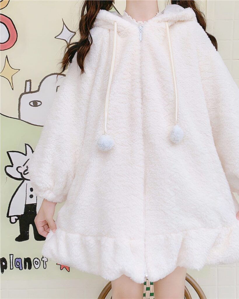 Fluffy bunny ears coat, a white hooded plush jacket with pom-poms.