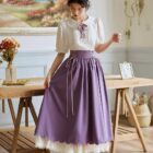 Purple cottagecore aesthetic dress with lace trim and ribbon tie details.