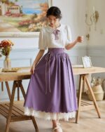 Purple cottagecore aesthetic dress with lace trim and ribbon tie details.