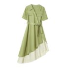 French vintage dress featuring a green and cream asymmetrical design with a belted waist.