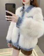 White denim fur coat, Y2K aesthetic outerwear layered over denim jacket and leather shorts.