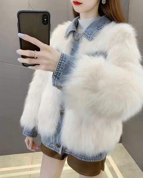 White denim fur coat, Y2K aesthetic outerwear layered over denim jacket and leather shorts.