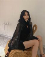 Black Korean aesthetic dress with long sleeves, worn by a model.