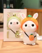 Kawaii bunny plushie Cotton the Adventurous Rabbit with carrot and avocado accessories in packaging.