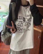 Long sleeve dog doodle t-shirt featuring hand-drawn dog illustrations.