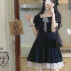 Black puffy dress with lace trim, part of a dark kawaii aesthetic outfit.