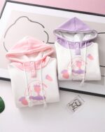 Two Kawaii Harajuku happy rabbit hoodies, featuring a food-themed print and contrasting colors.