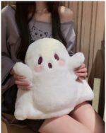 White ghost plushie backpack being held by a person.