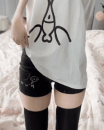 Cute Cotton Black Shorts - Kaomoji aesthetic shorts being worn with a graphic tee.