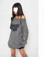 Off-shoulder gothic aesthetic sweater in a distressed gray knit, featuring a textured design.