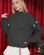 Dark gothic aesthetic sweater featuring a ribbed knit and embroidered crosses on a model's upper body.