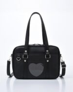 Black japanese schoolbag with heart window and handles.