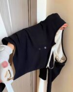 Black vintage aesthetic sweatshirt with knitted bow closure.