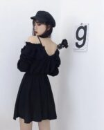 Solid black gothic aesthetic dress with off-the-shoulder sleeves and ruffles.