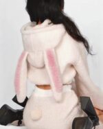 Pink bunny hooded plush pajamas with fluffy ears and a tail. Kawaii winter sleepwear.