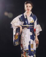 Satin Japanese kimono featuring a detailed floral and landscape design.