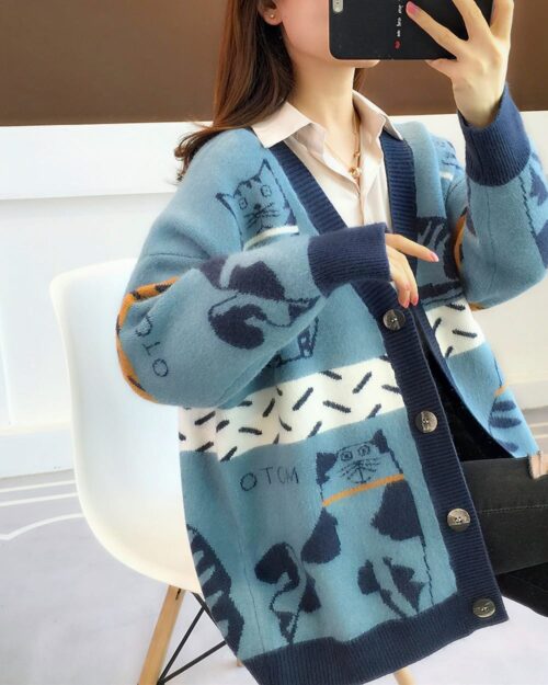 Blue cat cardigan sweater with vintage-inspired print details.