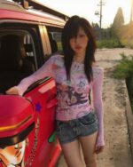 Retro pink cutecore top worn by a woman outdoors next to a red vehicle.