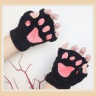Black neko paw gloves on a hand, featuring paw-shaped padded fingertips. Winter Collection.