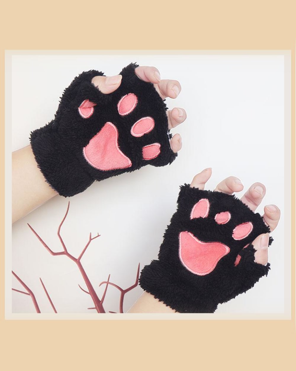 Black neko paw gloves on a hand, featuring paw-shaped padded fingertips. Winter Collection.