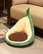 A green kawaii fruit cushion shaped like an avocado, with a plush interior and seat.