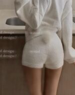 Close-up of fluffy bunny pajamas in soft white, featuring a delicate, layered design.