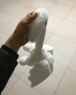 Close-up of a white bat rabbit plushie, aesthetic plushies.