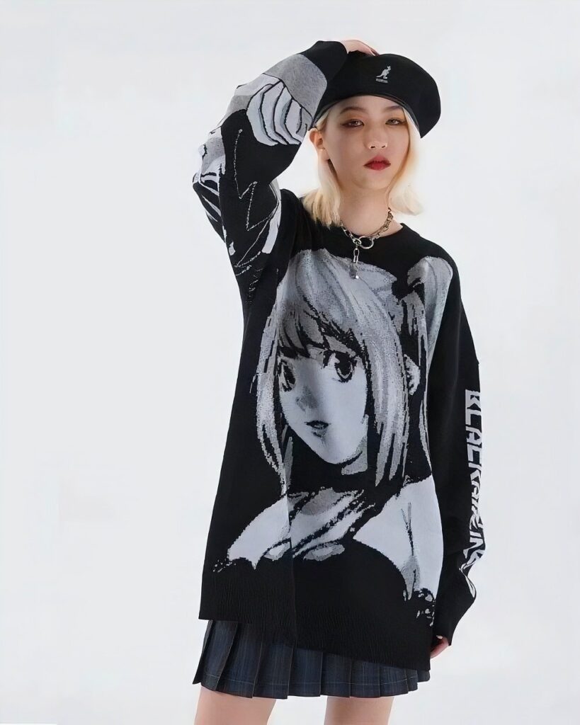 Black animecore sweater featuring a print of Light Yagami from Death Note, worn by a model.