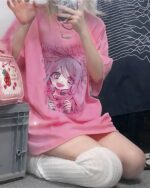 Pink unidrone oversized t-shirt with anime graphic and long sleeves.