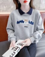 Grey korean aesthetic sweatshirt with cute bear embroidery and a blue collar.